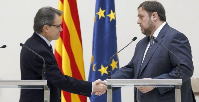 Artur Mas (CDC) y Oriol Junqueras (ERC) en un acto en el Parlament. Archivo EFE