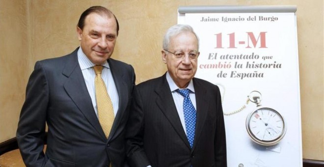 Jaime Ignacio del Burgo, expresidente de la diputación de Navarra, junto al exdiputado del PP, Martínez Pujalte, durante la presentación de un libro del primero sobre el 11-M- EFE