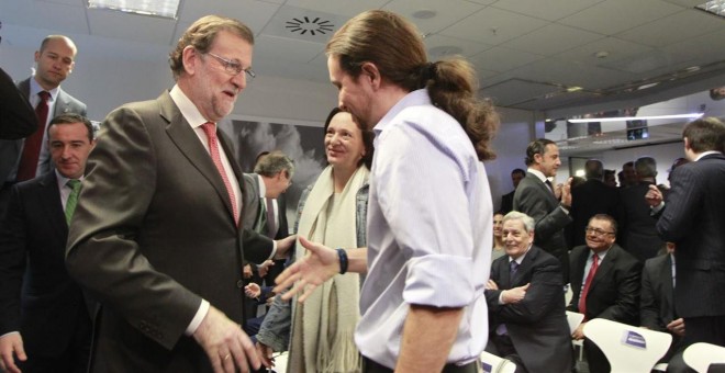 Mariano Rajoy junto al líder de Podemos, Pablo Iglesias. EUROPA PRESS