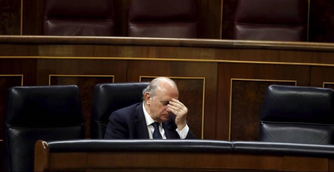 El Ministro de Interior, Jorge Fernandez Díaz, durante el debate y votación de la Ley de Seguridad Ciudadana el pasado julio, conocida como 'Ley Mordaza'. (Foto: Reuters)   Leer más:  Elecciones Generales 2016: Todos los partidos (salvo el PP) piden la di