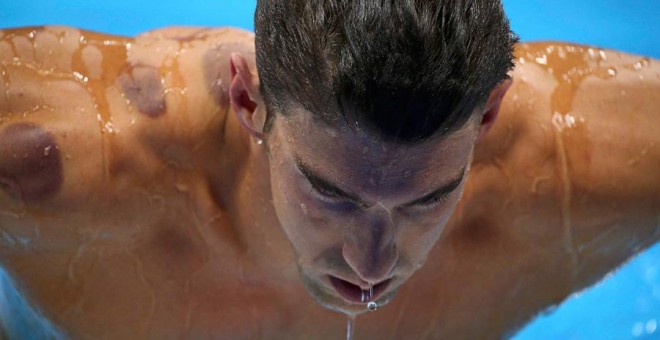 Michael Phelps, durante la eliminatoria de los 200 mariposa en los Juegos Olímpicos. REUTERS/Michael Dalder