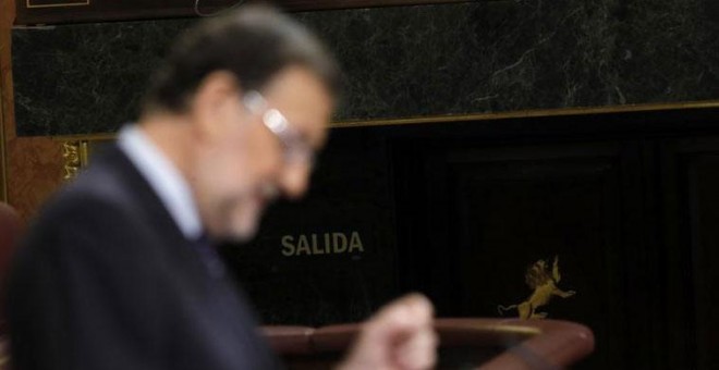 El presidente del Gobierno en funciones, Mariano Rajoy, durante su intervención en la tercera sesión del debate de su investidura, que se celebra en el Congreso de los Diputados. EFE/JuanJo Martín