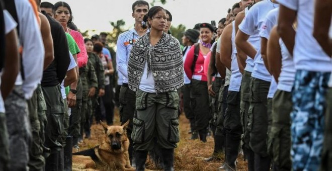 Miembros de las FARC durante la ceremonia de inauguración de la X Conferencia. - AFP