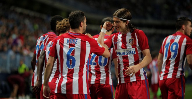 Koke y Filipe Luis celebran la victoria ante el Málaga.- REUTERS