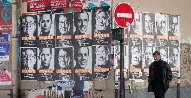 Fotografías de los candidatos presidenciales franceses en París. - AFP