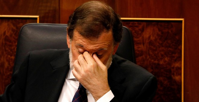 El presidente del Gobierno, Mariano Rajoy, este miércoles, en el pleno del Congreso donde la oposición le interpeló por la presunta financiación irregular del PP. REUTERS/Paul Hanna