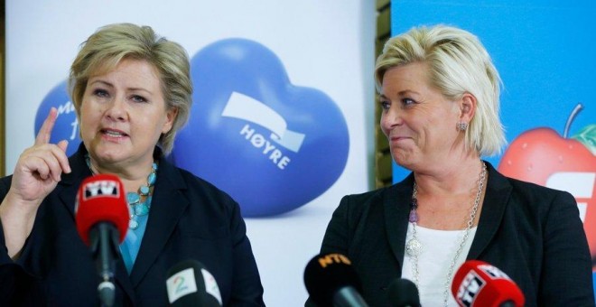 La primera ministra noruega, la conservadora Erna Solberg (izq.), junto a su socia de Gobierno, Siv Jensen, del populista de ultraderecha Partido del Progreso.- REUTERS