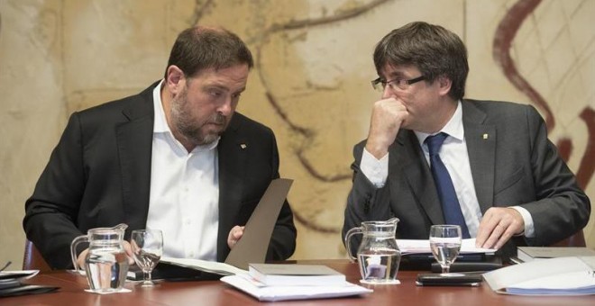 Oriol Junqueras y Carles Puigdemont. / MARTA PÉREZ (EFE)