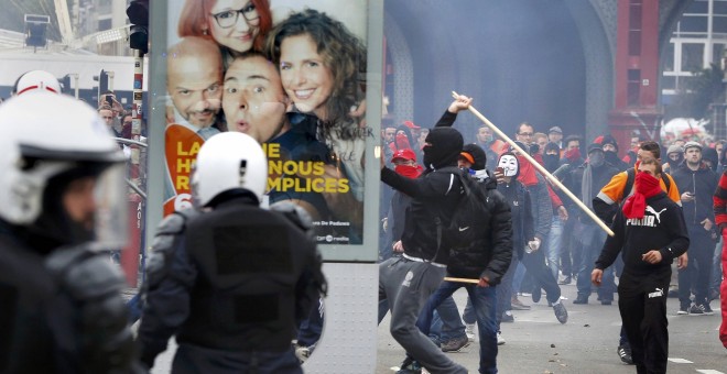 Un manifestante rompe un panel publicitario durante los enfrentamientos en Bruselas durante una marcha contra las reformas y recortes del gobierno belga.- REUTERS/Yves Herman