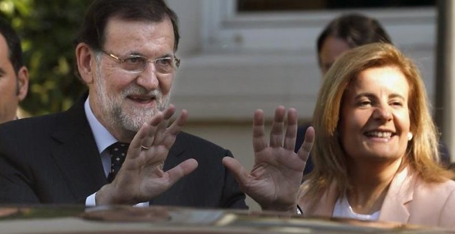 El presidente del Gobierno, Mariano Rajoy, con su ministra de Empleo, Fátima Báñez, impulsora de la reforma laboral de 2012.