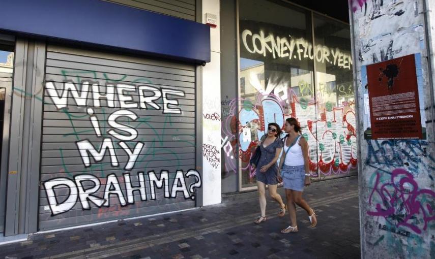 "¿Dónde están mis drahmas?" Otra pintada en el centro de Atenas. - REUTERS