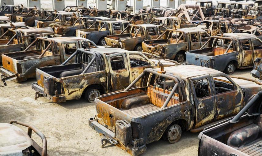 Burned Afghan National Army trucks wait to be demolished on the massive Bagram Air Field in the Parwan province of Afghanistan January 2, 2015. The base is being shrunk by demolishing large swaths of housing in order to hold roughly 13,000 foreign troops,