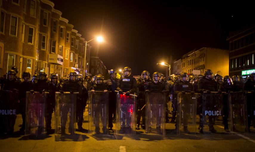 Police line up shortly before the deadline for a city-wide curfew passed in Baltimore. REUTERS/Eric Thayer