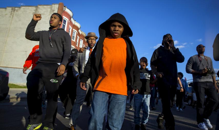 People march near North Ave and Pennsylvania Ave in Baltimore. REUTERS/Eric Thayer