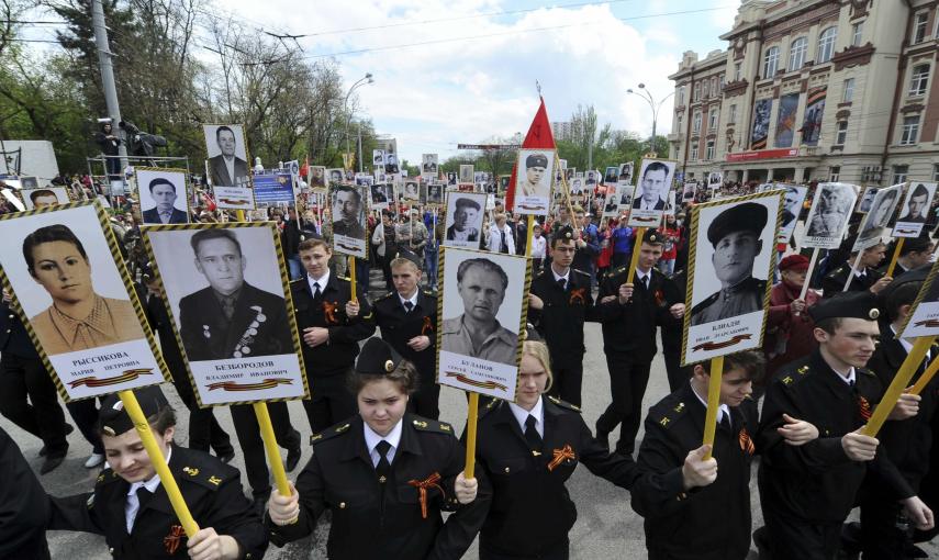 People hold pictures of World War Two soldiers as they take part in the Immortal Regiment march in Rostov-on-Don, Russia. REUTERS/Host Photo Agency/RIA Novosti