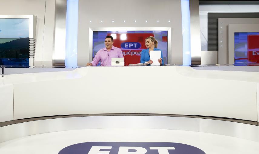 State television presenters Nikos Angelidis (L) and Vassiliki Haina prepare for the first broadcast of the station after its reopening./ REUTERS/Alkis Konstantinidis