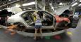 Auto worker Linda Martinez installs a part on a 2015 Chevrolet Malibu being built at GM's Fairfax assembly plant in Kansas City Kansas May 4, 2015. REUTERS/Dave Kaup