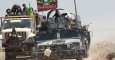 Fuerzas se seguridad irakíes y combatientes chiíes ern sus vehículos militares cerca de la localidad de Faluya. REUTERS/Alaa Al-Marjani