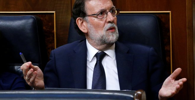 El presidente del Gobierno, Mariano Rajoy, en su escaño, durante la primera jornada de la moción de censura. REUTERS/Juan Medina