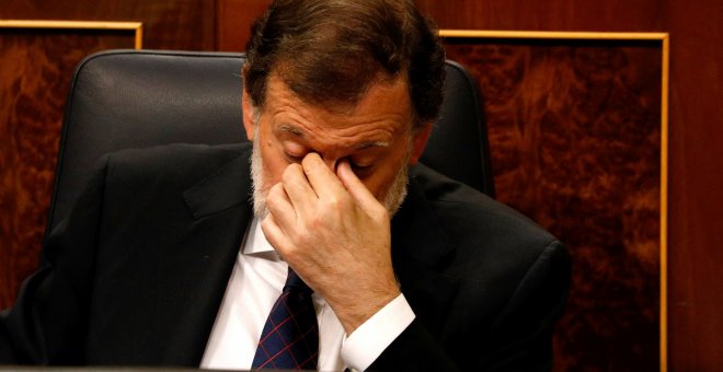 El presidente del Gobierno, Mariano Rajoy, este miércoles, en el pleno del Congreso donde la oposición le interpeló por la presunta financiación irregular del PP. REUTERS/Paul Hanna