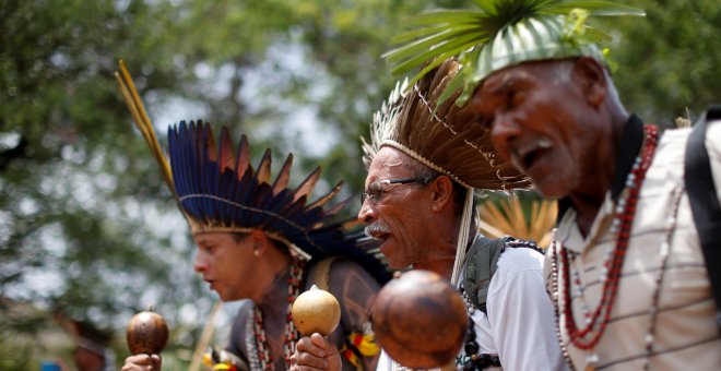 FILE PHOTO: Indigenous people from various tribes dance as they wait to deliver a letter to Brazil's President-elect Jair Bolsonaro at a transitional government building in Brasilia, Brazil, December 6, 2018. REUTERS/Adriano Machado/File Photo