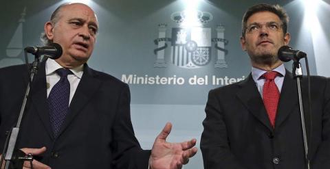 Los ministros de Justicia, Rafael Catalá (d), y de Interior, Jorge Fernández Díaz