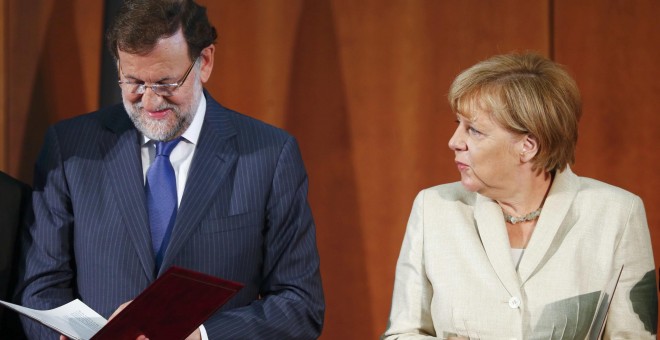 El presidente del Gobierno, mariano Rajoy, junto a al canciller alemana, Angela Merkel, en un encuentro en BerlÍn.- REUTERS