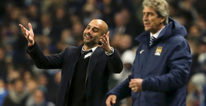 Guardiola junto a Pellegrini en un partido de Champions de la temporada pasada. /REUTERS