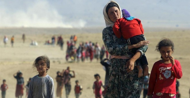 Foto de archivo de una familia de desplazados a causa de la guerra en Siria. / RODI SAID (REUTERS)