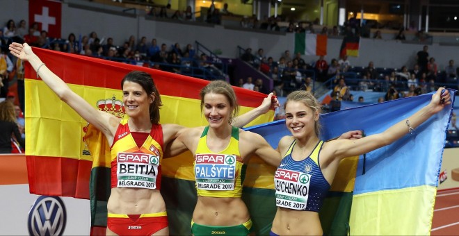 Beitia Ruth of Spain (L), Lithuania's Airine Palsyte and Ukraine's Yuliya Levchenko (R) pose with their national flags after competing in the Women's High Jump final at the European Athletics Indoor Championships in Belgrade, Serbia, 04 March 2017. (Españ