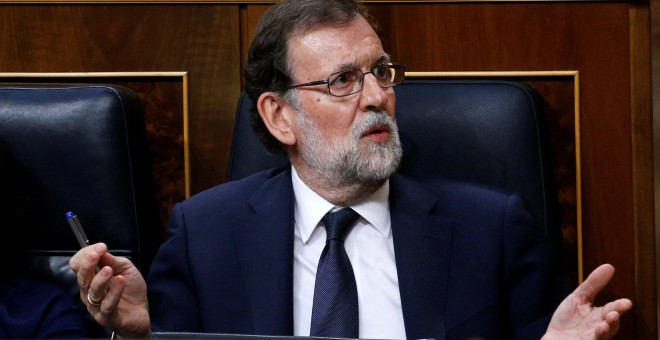 El presidente del Gobierno, Mariano Rajoy, en su escaño, durante la primera jornada de la moción de censura. REUTERS/Juan Medina