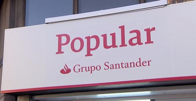 Los rótulos de las más de 1.200 oficinas de los bancos Popular y Pastor comienzan estos días a mostrar el color corporativo y la marca del Grupo Santander, su dueño desde junio.
