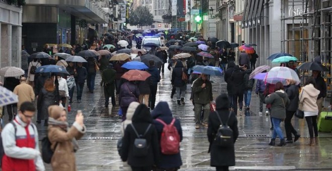 Lluvia en una calle de Madrid. EUROPA PRESS/Archivo
