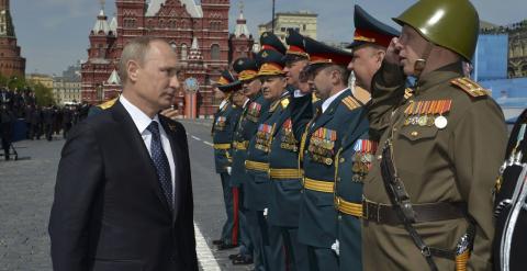 Russia's President Vladimir Putin (L) greets the commanders of units, participants of the Victory Day parade at Red Square in Moscow, Russia. REUTERS/Host Photo Agency/RIA Novosti