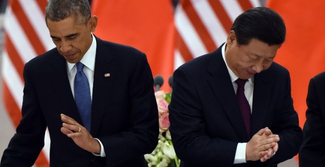 El presidente de China, Xi Jinping, junto a si homólogo estadounidense, Barack Obama, en noviembre de 2014. - AFP