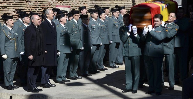 El ministro en funciones Jorge Fernández Díaz, durante el funeral por el guardia civil. EFE