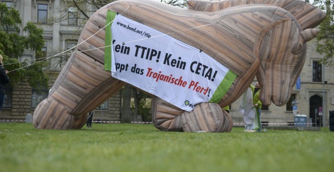 Protesters set up an inflatable 'Trojan Horse' as they demonstrate against TTIP and CETA trade agreements ahead of U.S. President Barack Obama's visit in Hannover