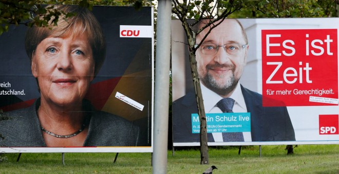Carteles electorales de Angela Merkel y Martin Schulz.REUTERS/Fabrizio Bensch