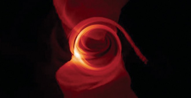 Así se vería Sagitario A, una sombra circular rodeada por el plasma que engulle el agujero negro en el centro de la Vía Láctea. La sombra no es negra porque parte del plasma está entre el agujero negro y el observador./CHI-KWAN CHAN/UNIVERSITY OF ARIZONA