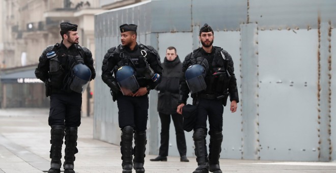 French gendarmes secure the Champs-Elysees avenue in front of the famed restaurant Fouquet's during the Act XIX (the 19th consecutive national protest on a Saturday) of the 'yellow vests' movement in Paris