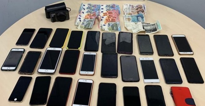 13/07/2019 - Dinero y teléfonos móviles robados por una mujer durante el Mad Cool. / POLICÍA MUNICIPAL DE MADRID