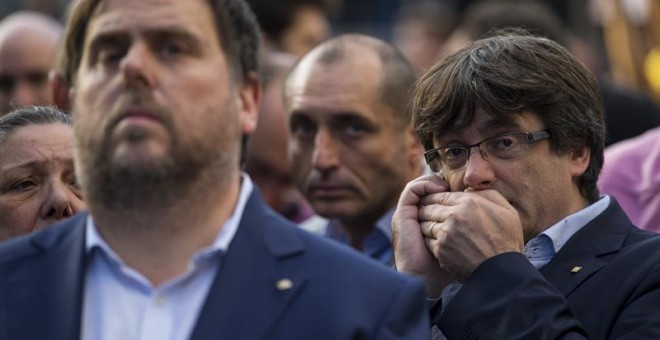 Oriol Junqueras i Carles Puigdemont en una imatge d'arxiu durant una manifestació. EFE / Enric Fontcoberta