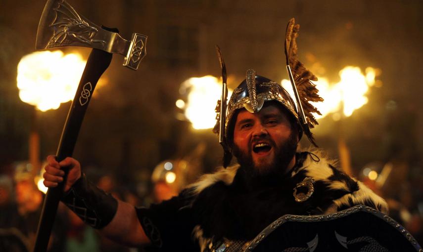 Up Helly Aa vikings from the Shetland Islands hold lit torches during the annual torchlight procession to mark the start of Hogmanay (New Year) celebrations in Edinburgh, Scotland December 30, 2014. The annual torchlight procession finishes with a firewor