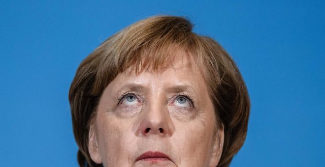 La canciller alemana y líder de la Unión Cristianodemócrata (CDU), Angela Merkel, durante la rueda de prensa tras las negociaciones para la formación de Gobierno con el jefe de la Unión Socialcristiana de Baviera (CSU), Horst Seehofer, y el líder del Part