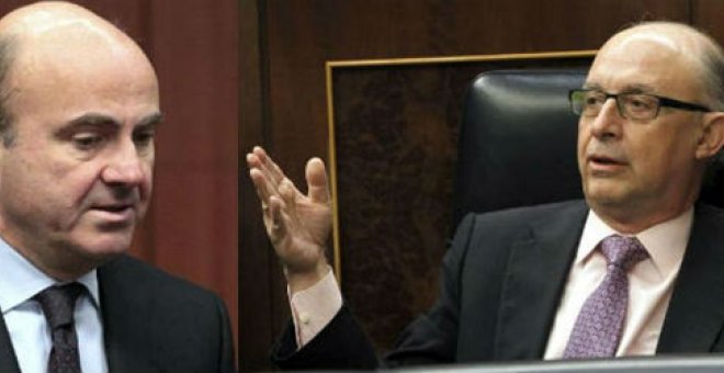 El ministro de Economía, Luis de Guindos (i), y el titular de Hacienda, Cristóbal Montoro. EFE