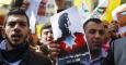 Palestinos participan en una manifestación para mostrar su solidaridad por la ejecución del piloto jordano Muaz Kasasbeh. - EFE