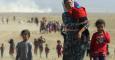 Miembros de la secta minoritaria de los Yazidi huyen de la violencia del Estado Islámico, y se dirigen a la frontera siria (11 de agosto de 2014). REUTERS/Rodi Said
