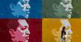 Una mujer camina frente a un muro con imágenes de Chávez en Caracas. - EFE