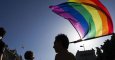 Toni Poveda presidente de la Federacion Estatal de Gays Lesbianas Bisexuales y Transexuales posa con la bandera gay en una imagen de archivo.