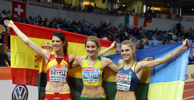 Beitia Ruth of Spain (L), Lithuania's Airine Palsyte and Ukraine's Yuliya Levchenko (R) pose with their national flags after competing in the Women's High Jump final at the European Athletics Indoor Championships in Belgrade, Serbia, 04 March 2017. (Españ
